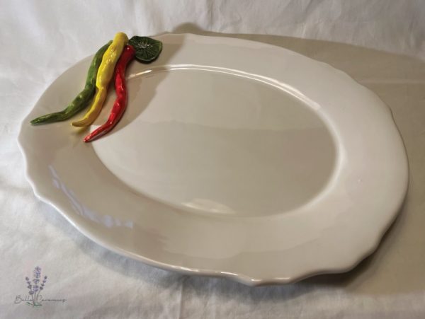 Grote ovale schaal pepers